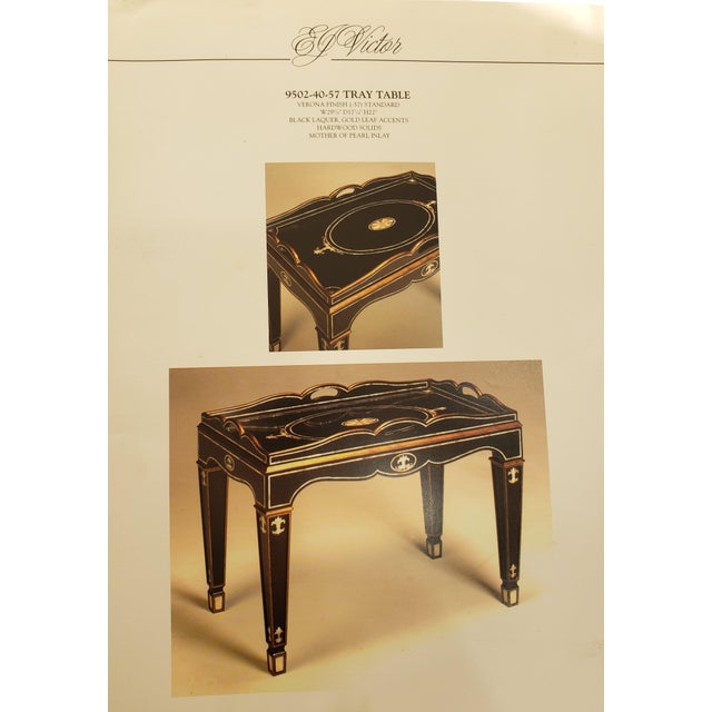 Elegant EJ Victor tray table in excellent condition, model 9502-40-57 finished in rich black lacquer with gold leaf...