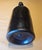An exceptional and highly collectible authentic 1850s black glass bottle, showcasing the rich character and craftsmanship...