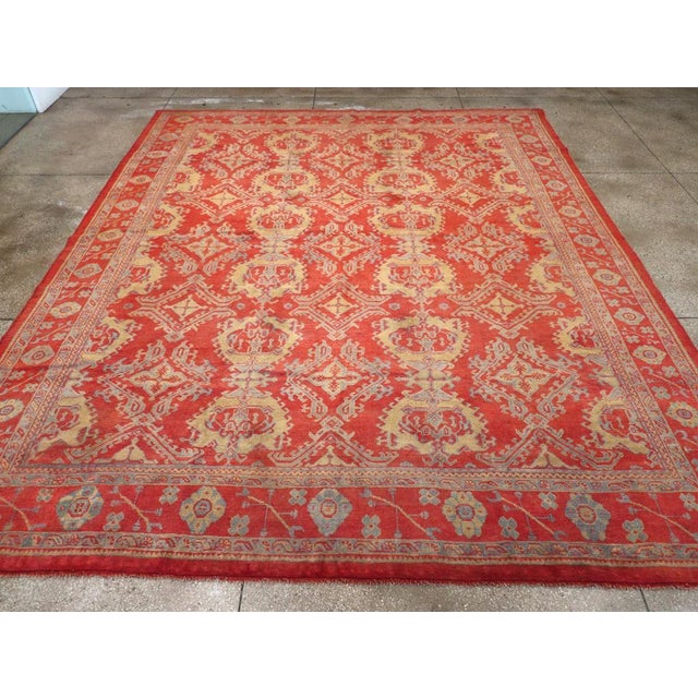 An antique Turkish Oushak large room size carpet handmade during the Early 20th century. Measures: 12' 1" x 14' 8"