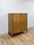 This clean and well-proportioned vintage mid-century modern tallboy dresser with brass accents is a classic and versatile...
