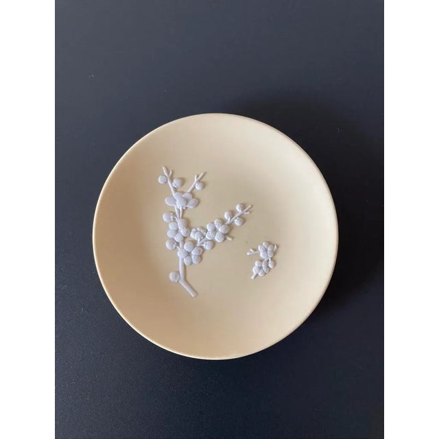 A beautiful English Wedgwood Jasperware light yellow and white jewelry dish in the Asian Modern design style, circa...