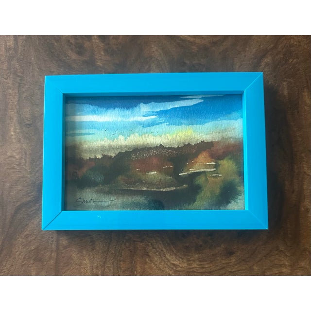 Bring a sense of serenity to your space with this original watercolor landscape, capturing the soft transition of earth...