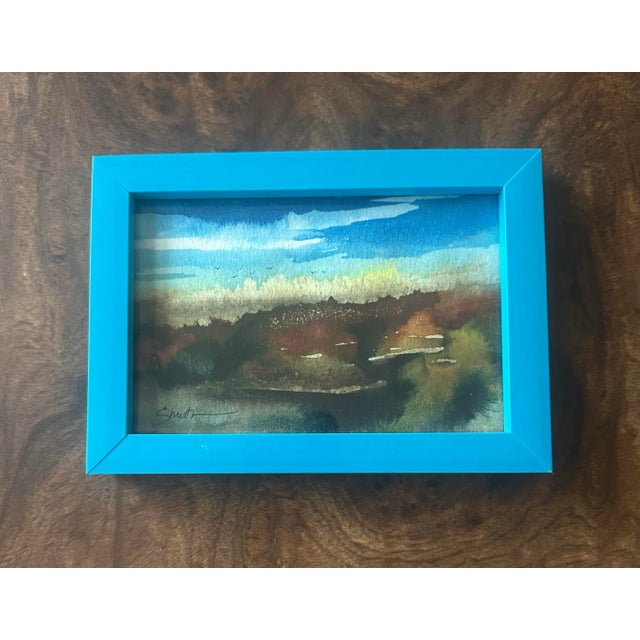 Bring a sense of serenity to your space with this original watercolor landscape, capturing the soft transition of earth...