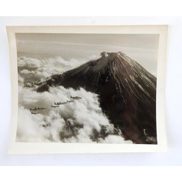 1952 aerial photograph taken over Mt. Fuji in Japan. F-94's of the 35th Fighter Wing, November 1952. Unframed, age toning,...
