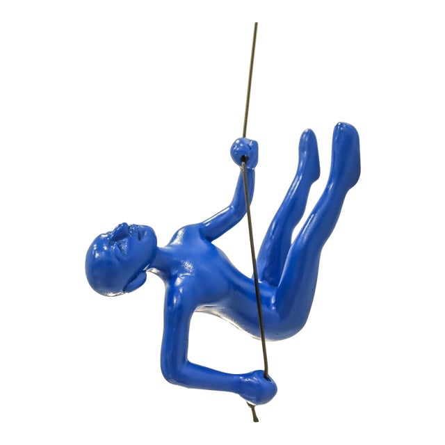 Blue Climbing Man Wall Art For Sale