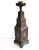 This fine, six-sided brass candlestick has been engraved and inlaid with silver and copper strips in broad bands of Kufic...