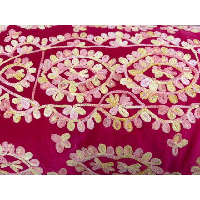 Colorful lush, fuchsia, velvet accent pillow with zipper bottom and embroidered textural design pattern on the front....