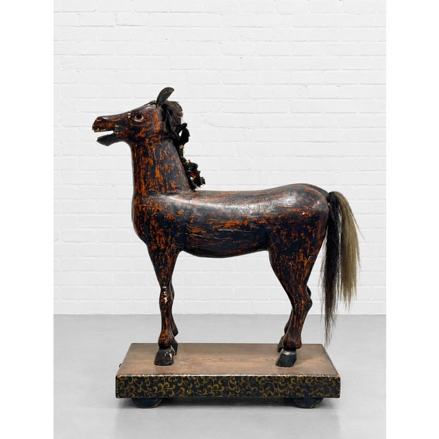 Highly expressive antique European folk horse, hand carved from solid wood and retaining its original painted surface,...