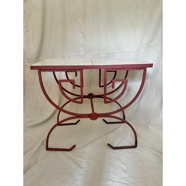 A one of a kind accent table in the celebrated manner of midcentury ironwork designers like John Salterini. This piece...