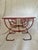 A one of a kind accent table in the celebrated manner of midcentury ironwork designers like John Salterini. This piece...