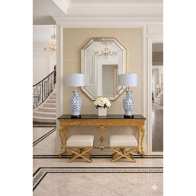 Offering a restored vintage blue and white hand painted Chinese porcelain table lamps, circa Mid 20th Century. The...