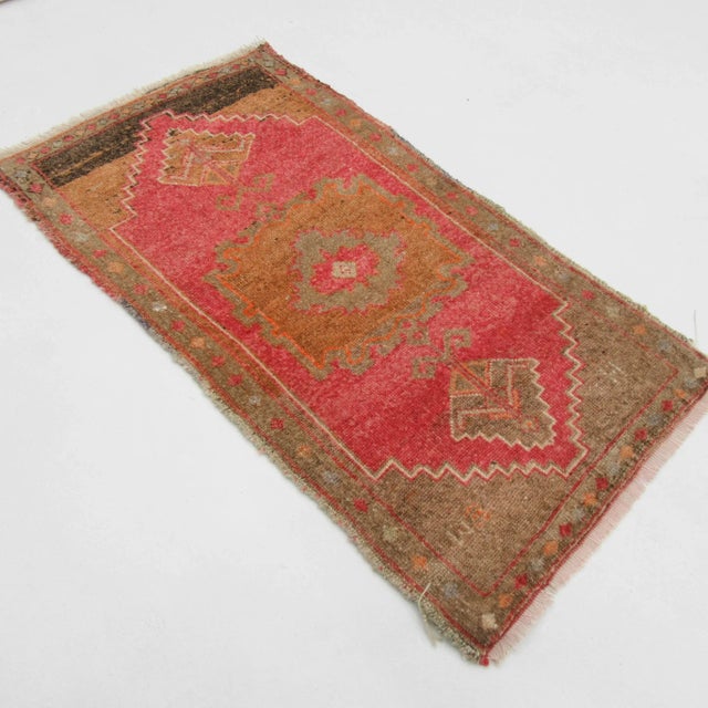 Vintage handknotted decorative mini rug from Kars region of Turkey. Approximately 50-60 years old. In very good condition.