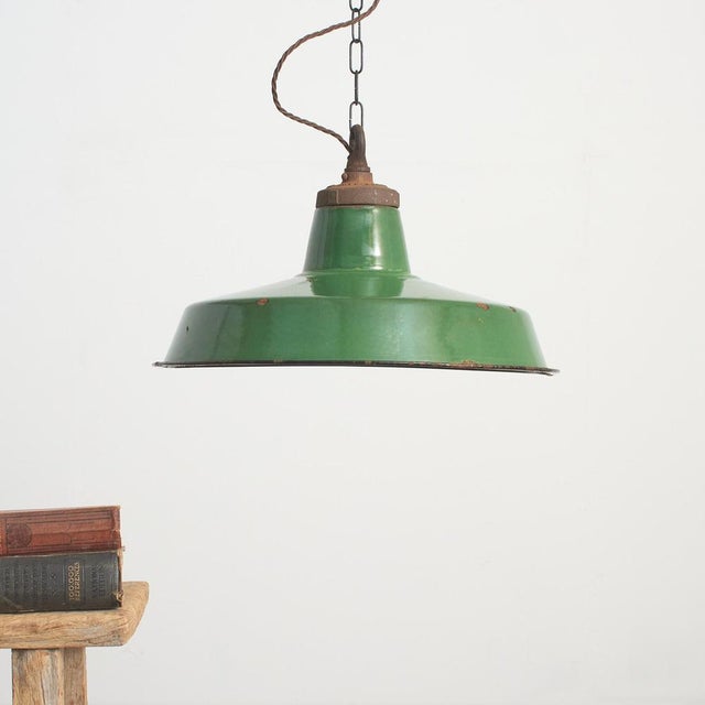 Early english industrial shade by ‘benjamin’ salvaged from an old warehouse. The vitreous enamelled spun steel shade is...