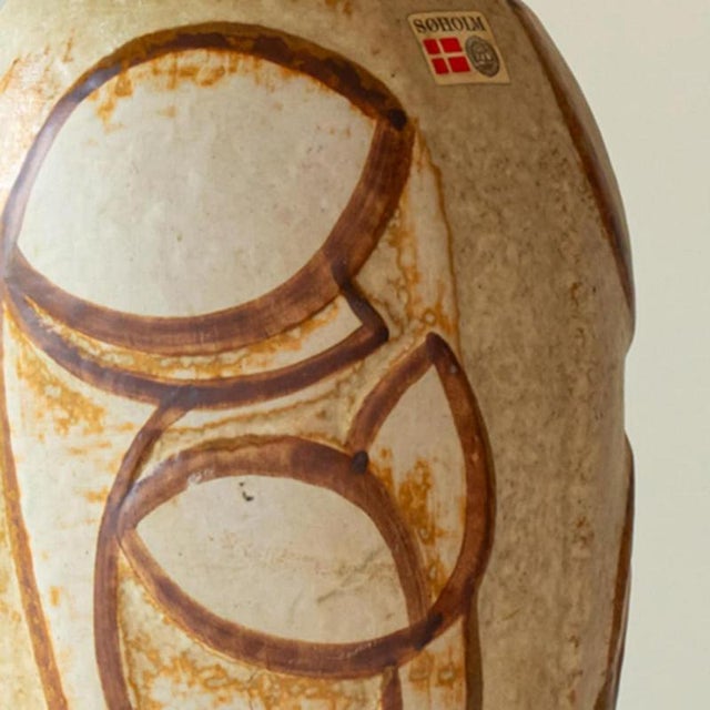 Beautiful set of two ceramic table lamps by, noomi backhausen for soholm, denmark 1960s. The warm beige tones of the base...