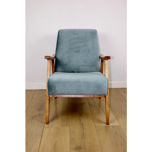 Vintage loft armchair from the 1970s in light blue. An original, restored 1970s Vintage Loft armchair featuring new blue...