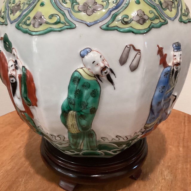 Antique Chinese Porcelain Ginger Jar With Molded Raised Eight Immortals on Wood Base For Sale In Chicago - Image 6 of 12