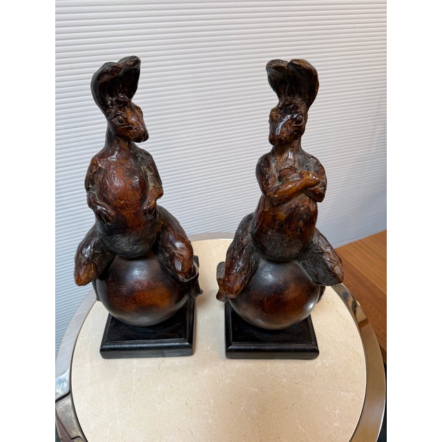 Design Plus Gallery presents a Pair of Bunnies Sitting on Balls from Attila's. The bunnies are made from some sort of...
