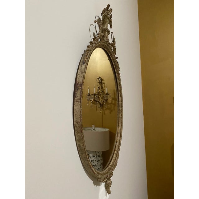 Antique French Mirror. Frame is distressed and lovely. Shows signs of wear and age. The mirrored part itself is in very...