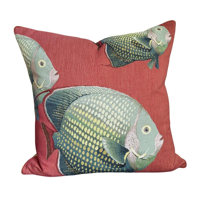 Beautiful pair of luxury decorative pillows by Iosis Paris featuring vibrant tropical fish motifs against a sophisticated...