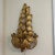 Gorgeous sconce with gold leaves and three arms. The leaves make a perfect triangle shape to make this a statement piece...