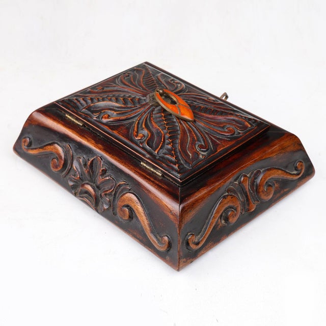 This beautifully carved wooden sewing box was crafted in France around 1900, bridging the transition between Art Nouveau...
