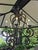 This is a European-style wrought iron chandelier featuring hand-forged scrolled arms and a dark, rustic finish. Design...