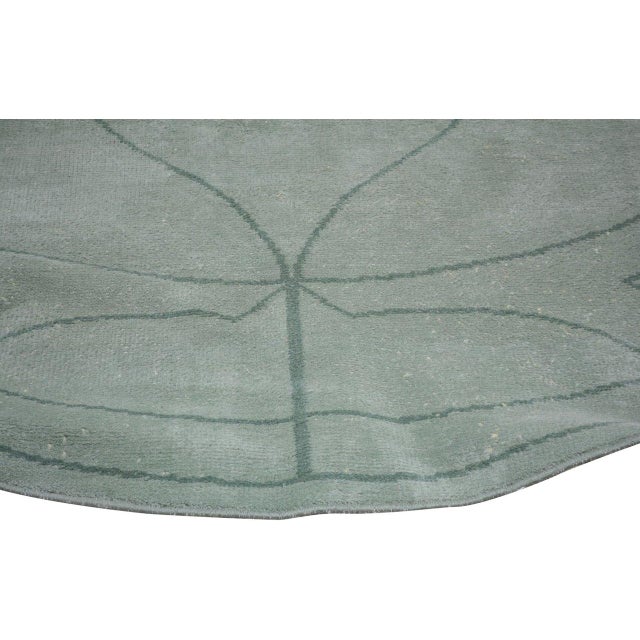 Hand-knotted with care using traditional rug-making techniques, this wool rug blends timeless craftsmanship with a modern...