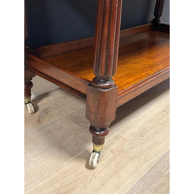 Antique mahogany tiered stand in good, original condition. Suitable for various purposes, such as books, magazines,...