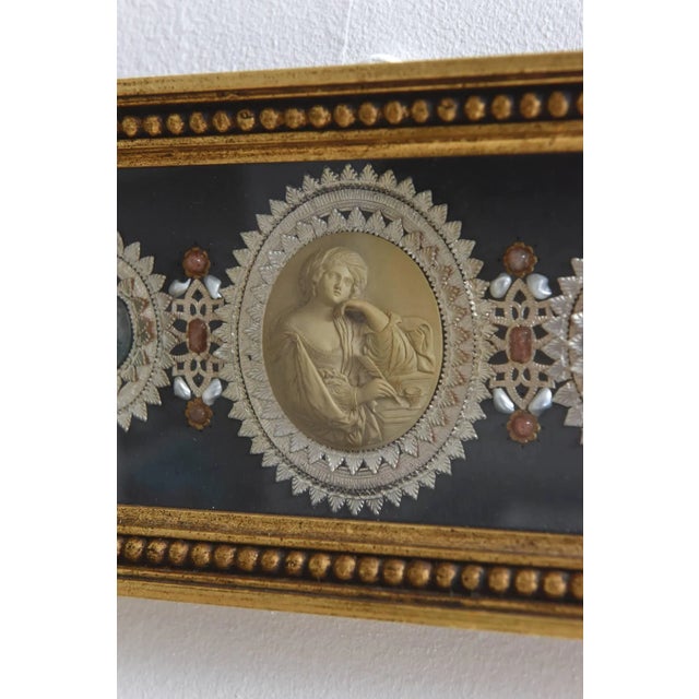 (1) Large lava cameo approximately 2 1/4” x 1 3/4” depicts robed woman in thinker position flanked by (4) smaller lavas...