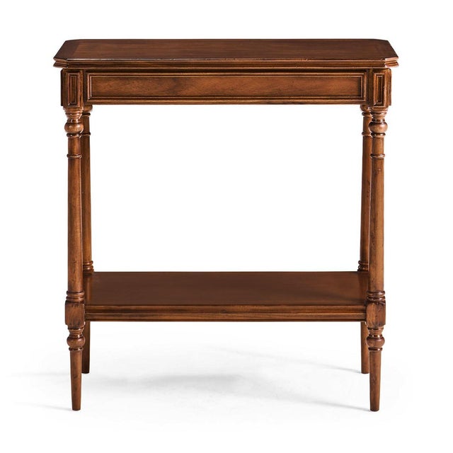 Restrained Georgian style side table in distressed walnut, with a canted corner rectangular top set between tapering...