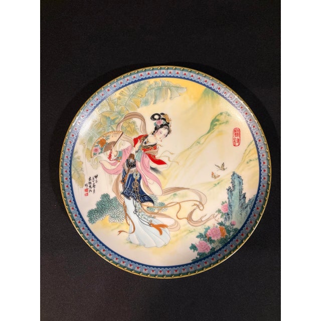 This pair of Imperial Jingdezhen porcelain collector plates feature the vibrantly colored art of master artist Zhao...