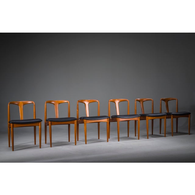 Elegant set of six “juliane” dining chairs designed by johannes andersen for uldum møbelfabrik, denmark, 1960s. Crafted...