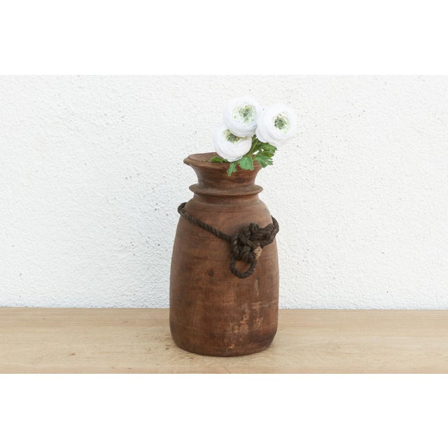 Originally used in village homes for storing milk, ghee, or grains, this antique wooden pot has survived generations of...