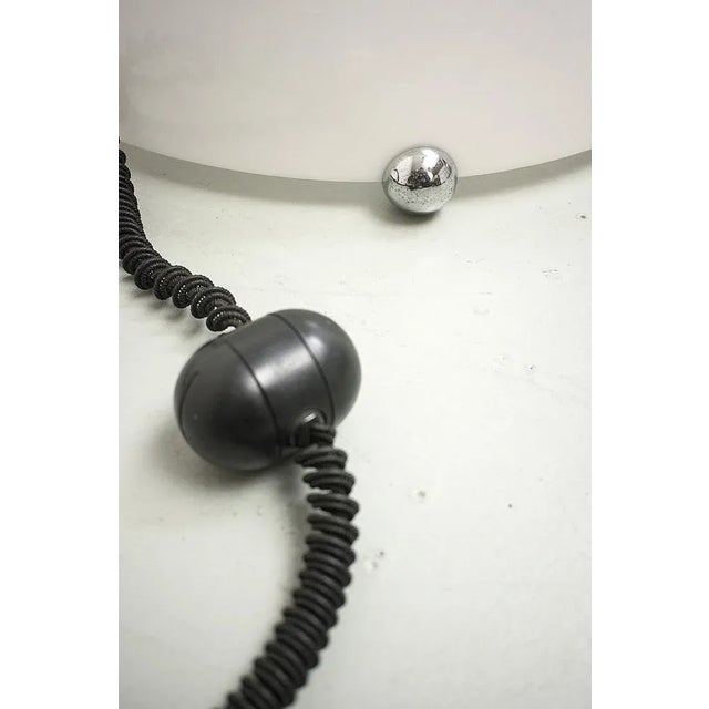 Italian acrylic floor lamp with an egg-shaped dimmer. In a good vintage condition. Measurements H. 24 cm; Ø 45 cm....