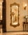 Bring instant grandeur to a room with this oversized 77-inch ornate gold mirror, a dramatic statement piece inspired by...