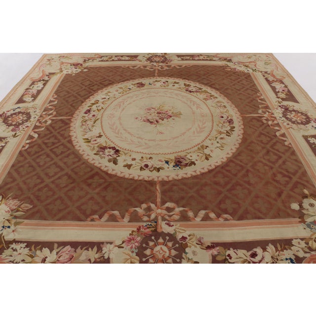 Hand-woven in France during the mid-to-late 19th century, this 11x11 antique Aubusson rug is a rare and poetic example of...