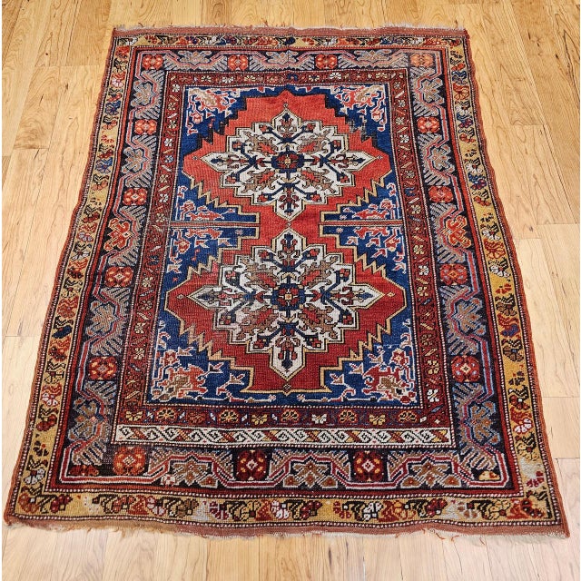 This exceptional 19th Century Turkish Anatolian village rug is a rare and visually powerful example of late Ottoman-era...