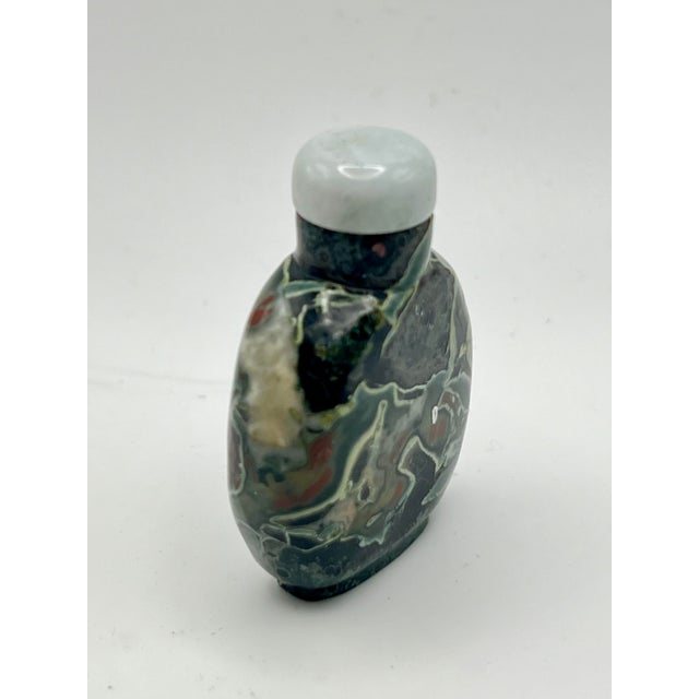 This bloodstone, or commonly known as frogskin snuff bottle is one of the more interesting stone bottles in my collection....