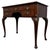 A handsome and finely crafted early 20th-century English Edwardian writing table, beautifully constructed in richly...