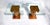 A pair of Ionic column Burl Walnut pedestal tables in the Neoclassical style with 1/2" glass tops by John Stuart; circa...