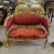 Elegance and comfort assured. Beautiful settee with gold details. Unique and gorgeous red fabric upholstery. Fully...