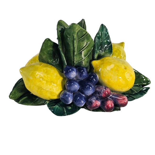 This is a lovely vintage topiary Candleholder . This candleholder is adorned with with pile of lemons and grapes....