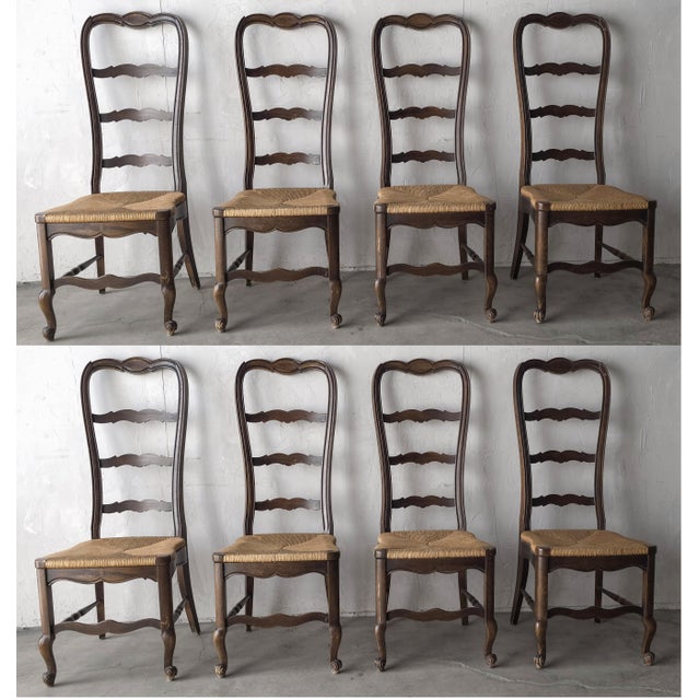 Nice set of 8 vintage, dark wood ladder back dining chairs with rush seats, they give a very antique French feel, popular...