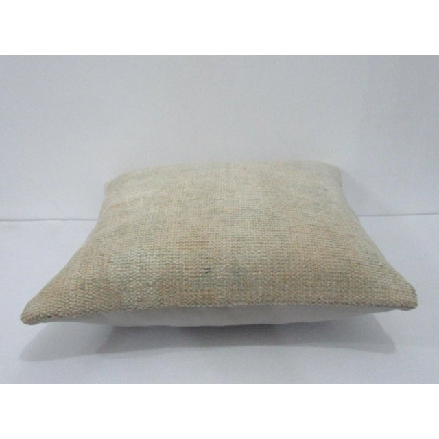 Decorative pillow cover made from a vintage Turkish handknotted rug. Backed with good quality cotton fabric. Pillow...