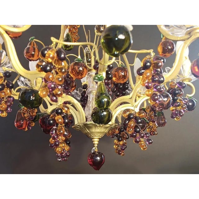 Chandelier from France around 1880, the chandelier is worked in brass, with extraordinary many glass fruits, grapes, red...