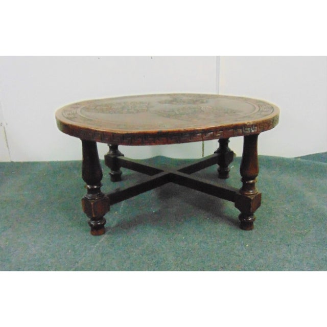 Mid Century Modern Coffee table , Embossed Leather Aztec design top , turned pine legs with stretchers , bun feet