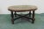 Mid Century Modern Coffee table , Embossed Leather Aztec design top , turned pine legs with stretchers , bun feet
