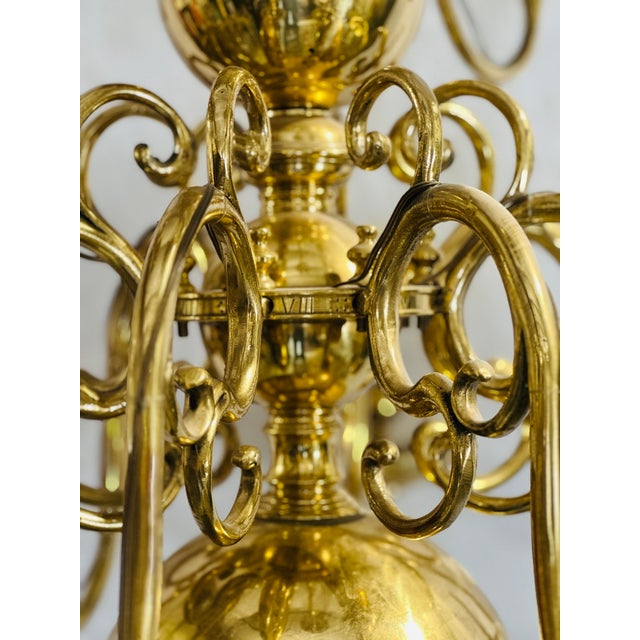 A remarkable 17th-century Dutch brass chandelier, dating to circa 1650, featuring the iconic “cannonball” form associated...