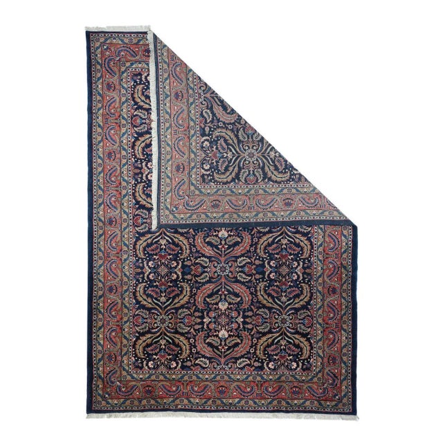 This visually striking, and probably unique design wise, SE Persian city carpet of medium-fine weave, shows a navy indigo...