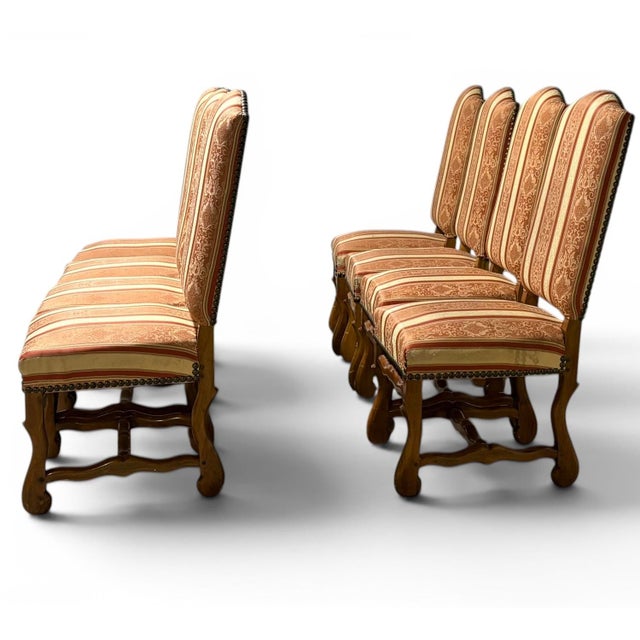Set of 8 dining chairs. A contemporary take on the classic Louis XIV Os De Mouton Chair, with a more ergonomic and...